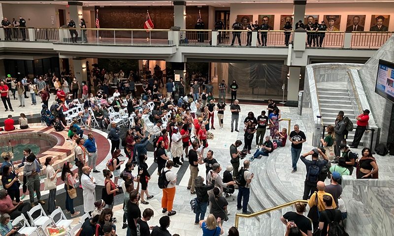Hundreds of people gather in Atlanta's City Hall on Monday, June 5, 2023, to speak ahead of a council vote over whether to approve tens of millions in public funding for the construction of a proposed police and firefighter training center that activists decry as "Cop City." More than 350 had signed up to speak during the meeting, with hundreds more unable to sign up in time, including a large crowd prevented from entering City Hall due to capacity concerns. (AP Photo/R.J. Rico)