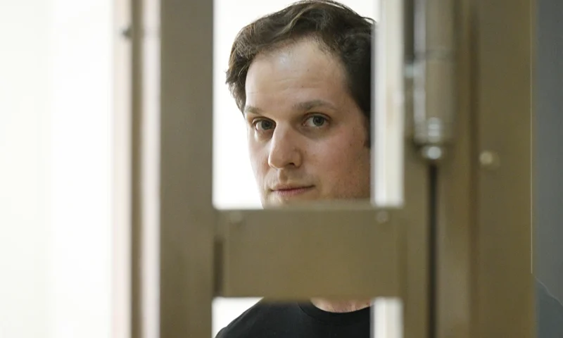 Wall Street Journal reporter Evan Gershkovich stands in a glass cage in a courtroom at the Moscow City Court in Moscow, Russia, Thursday, June 22, 2023. Gershkovich, a Wall Street Journal reporter detained on espionage charges in Russia, appeared in court Thursday to appeal his extended detention. (AP Photo/Dmitry Serebryakov)