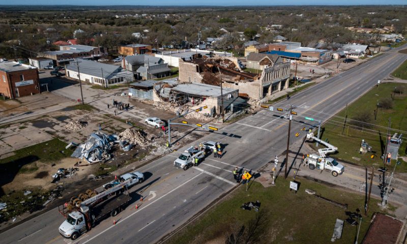 In this image taken with a drone, damage to buildings is visible after a severe thunderstorm on March 23, 2021 in Bertram, Texas. No injuries were reported but a suspected tornado heavily damaged multiple buildings, some of which are over a century old, in downtown Bertram. (Photo by Tamir Kalifa/Getty Images)
