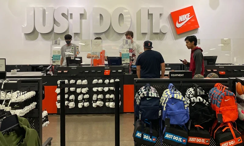 Customers make purchases at a Nike factory store on June 28, 2022 (Photo by Justin Sullivan/Getty Images)