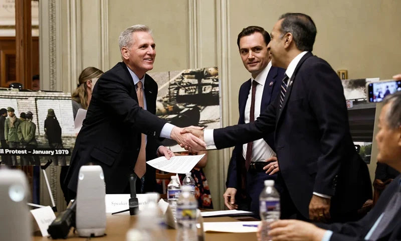 U.S. Speaker of the House Kevin McCarthy (R-CA) greets Chairman Mike Gallagher (R-WI) and Ranking Member Raja Krishnamoorthi (R-IL) speaks at an event to commemorate the 34th anniversary of the Tiananmen Square Massacre at the U.S. Capitol Building on June 05, 2023 in Washington, DC. Congressional leadership, members of the United States House Select Committee on Strategic Competition between the United States and the Chinese Communist Party and Chinese human rights activists attended the event. (Photo by Anna Moneymaker/Getty Images)