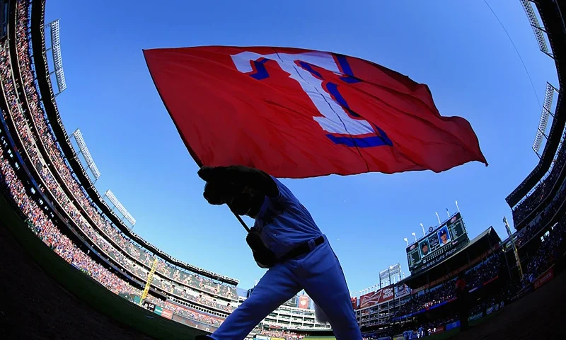 ARLINGTON, TEXAS - APRIL 04: Captain, the Texas Rangers mascot, waves the team flag after the Texas Rangers beat the Seattle Mariners 3-2 on Opening Day at Globe Life Park in Arlington on April 4, 2016 in Arlington, Texas. (Photo by Tom Pennington/Getty Images)
