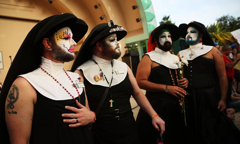 Members of the Sisters of Perpetual Indulgence attend a memorial service on June 19, 2016 in Orlando, Florida. The Sisters of Perpetual Indulgence are a charity, protest, and street performance organization that uses drag and religious imagery to call attention to sexual intolerance. Thousands of people are expected at the evening event which will feature entertainers, speakers and a candle vigil at sunset. In what is being called the worst mass shooting in American history, Omar Mir Seddique Mateen killed 49 people at the popular gay nightclub early last Sunday. Fifty-three people were wounded in the attack which authorities and community leaders are still trying to come to terms with. (Photo by Spencer Platt/Getty Images)