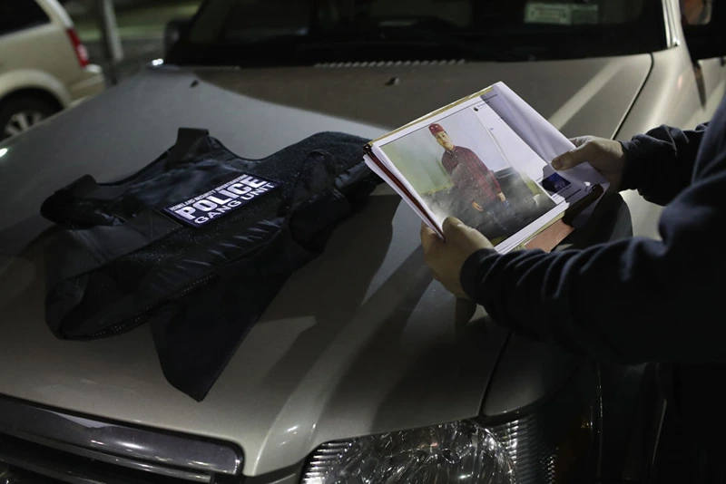 BRENTWOOD, NY - MARCH 29: U.S. federal agents prepare for an operation to arrest suspected gang members early on March 29, 2018 in Brentwood, New York. Overnight and into the morning, U.S. federal agents, led by Homeland Security Investigations (HSI), detained suspected gang members across Long Island in a surge of arrests. The actions were part of Operation Matador, a nearly year-long anti-gang effort targeting transnational gangs, with an emphasis on MS-13. (Photo by John Moore/Getty Images)