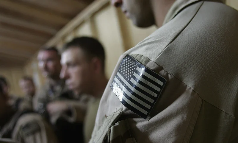 FALLUJAH, IRAQ - JULY 27: U.S. Navy SEALS are briefed before a night mission to capture Iraqi insurgent leaders July 27, 2007 near Fallujah, Iraq. American Special Forces operate throughout Iraq, targeting "high-value targets" in commando raids, often at night to take advantage of their night vision superiority. (Photo by John Moore/Getty Images)