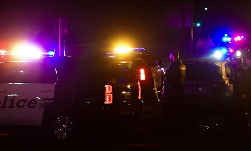 TOPSHOT - Police officers are seen at the intersection of US 101 freeway and the Moorpark Rad exit as police vehicles close off the area responding to a shooting at a bar in Thousand Oaks, California on November 8, 2018. - Twelve people, including a police sergeant, were shot dead in a shooting at a nighttclub close to Los Angeles, police said Thursday. All the victims were killed inside the bar in the suburb of Thousand Oaks late on Wednesday, including the officer who had been called to the scene, Sheriff Geoff Dean told reporters. The gunman was also dead at the scene, Dean added. The bar was hosting a college country music night. (Photo by Frederic J. BROWN / AFP) (Photo credit should read FREDERIC J. BROWN/AFP via Getty Images)