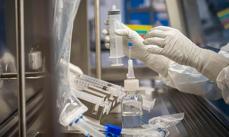 Employees in cleanroom suits test the procedures for the manufacturing of the messenger RNA (mRNA) for the Covid-19 vaccine at the new manufacturing site of German company BioNTech on March 27, 2021 in Marburg, central Germany. - German firm BioNTech said on March 30, 2021 it was on track to manufacture 2.5 billion doses of its Covid-19 vaccine this year with US partner Pfizer, 25 percent more than previously expected. (Photo by Thomas Lohnes / AFP) (Photo by THOMAS LOHNES/AFP via Getty Images)