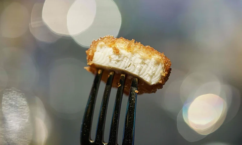 A nugget made from lab-grown chicken meat is seen during a media presentation in Singapore, the first country to allow the sale of meat created without slaughtering any animals, on December 22, 2020. (Photo by Nicholas YEO / AFP) (Photo by NICHOLAS YEO/AFP via Getty Images)