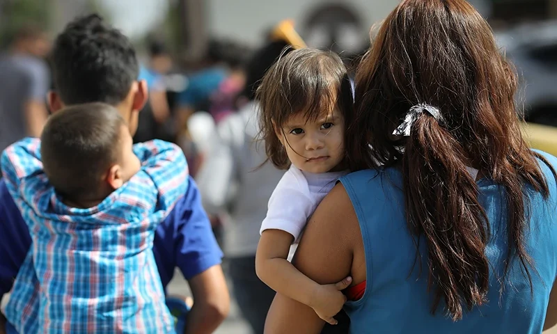 MCALLEN, TX - JUNE 11: Central American immigrant families depart ICE custody, pending future immigration court hearings on June 11, 2018 in McAllen, Texas. Thousands of undocumented immigrants continue to cross into the U.S., despite the Trump administration's recent "zero tolerance" approach to immigration policy. (Photo by John Moore/Getty Images)