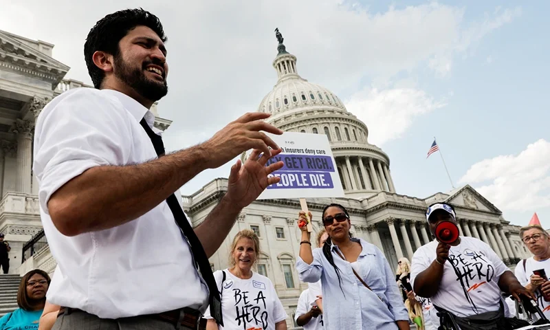 U.S. Rep. Greg Casar (D-TX) talks to supporters during the sixth hour of a thirst strike outside the U.S. Capitol to protest a new Texas state law signed by Republican Governor Greg Abbott blocking local ordinances that mandate water breaks for workers, on Capitol Hill in Washington, U.S., July 25, 2023. REUTERS/Jonathan Ernst
