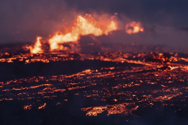 Lava emerges from a fissure of the Fagradalsfjall volcano near the Litli-Hrútur mountain, some 30 kilometers (19 miles) southwest of Reykjavik, Iceland, Monday July 10, 2023. Authorities in Iceland on Tuesday warned spectators to stay away from a newly erupting volcano that is spewing lava and noxious gases from a fissure in the country’s southwest. (AP Photo/Marco Di Marco)