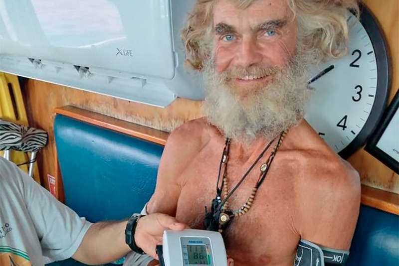 In this July 12, 2023 photo provided by Grupomar/Atun Tuny, Australian Tim Shaddock has is blood pressure taken after being rescued by a Mexican tuna boat in international waters, after being adrift with his dog for three months. Haddock and his dog Bella were aboard his incapacitated catamaran Aloha Toa some 1,200 miles from land when they were rescued. (Grupomar/Atun Tuny via AP)