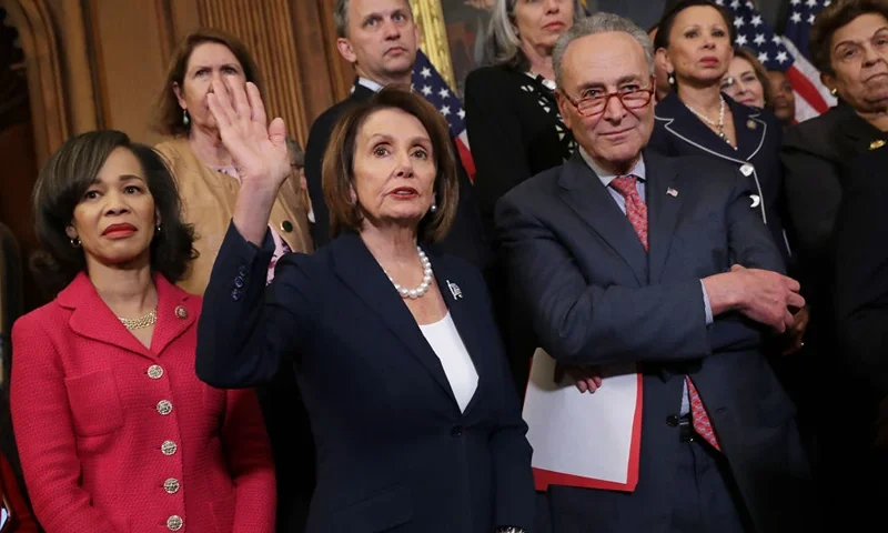 WASHINGTON, DC - MAY 15: (L-R) Rep. Lisa Blunt Rochester (D-DE), Speaker of the House Nancy Pelosi (D-CA), Senate Minority Leader Charles Schumer (D-NY) and other Congressional Democrats hold a rally and news conference ahead of a House vote on health care and prescription drug legislation in the Rayburn Room at the U.S. Capitol May 15, 2019 in Washington, DC. The bicameral group of Democrats urged Senate Majority Leader Mitch McConnell (R-KY) to bring the Strengthening Health Care and Lowering Prescription Drug Costs Act up for a vote in the Senate. (Photo by Chip Somodevilla/Getty Images)