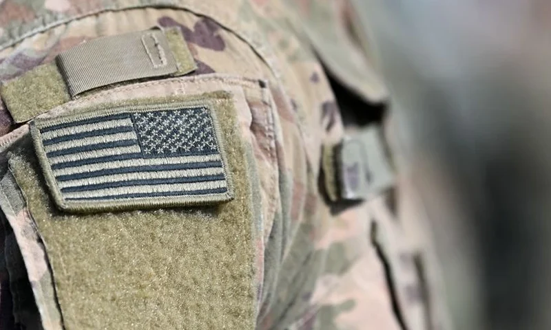 A soldier of the US army wears the country's flag on his uniform during the 'Dynamic Front 22', the US Army led NATO and Partner integrated annual artillery exercise in Europe, in Grafenwoehr, near Eschenbach, southern Germany, on July 20, 2022. - The 'Dynamic Front 22' exercise, led by 56th Artillery Command, is the premier US led NATO and Partner integrated artillery exercise in Europe and includes more than 3000 participants from 19 nations. Allied artillery and supporting units practice integrating joint fires and test interoperability in a multi-national enviroment until 24 July, 2022. (Photo by Christof STACHE / AFP) (Photo by CHRISTOF STACHE/AFP via Getty Images)