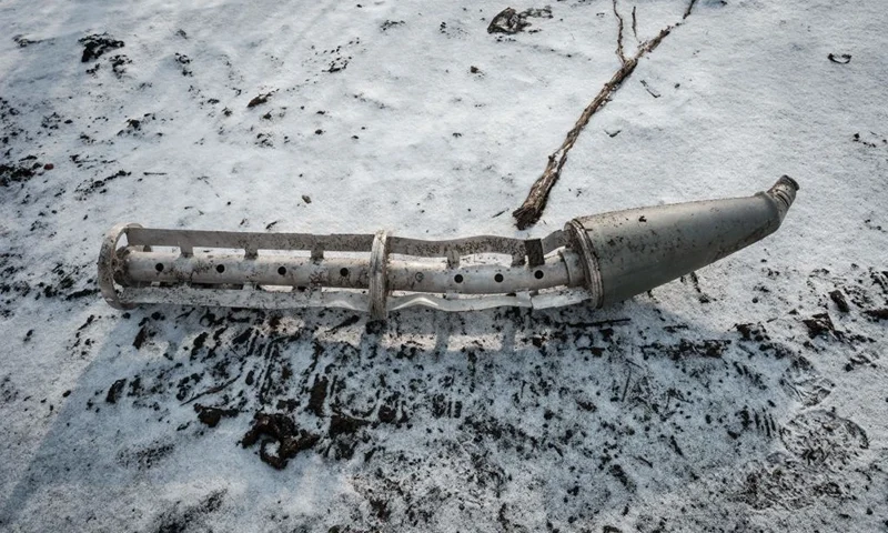 A casing of a cluster bomb rocket lays on the snow-covered ground in Zarichne on February 6, 2023, amid the Russian invasion of Ukraine. (Photo by YASUYOSHI CHIBA / AFP) (Photo by YASUYOSHI CHIBA/AFP via Getty Images)