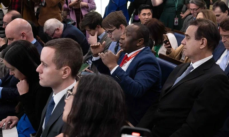 Today News Africa reporter Simon Ateba (C) interrupts as White House Press Secretary Karine Jean-Pierre (not pictured), begins the daily press briefing in the Brady Press Briefing Room of the White House in Washington, DC, March 20, 2023. (Photo by SAUL LOEB / AFP) (Photo by SAUL LOEB/AFP via Getty Images)