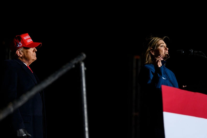 SIOUX CITY, IA - NOVEMBER 03: Governor Kim Reynolds (R-IA) joins former U.S. President Donald Trump during a campaign event at Sioux Gateway Airport on November 3, 2022 in Sioux City, Iowa. Trump held the rally to support for Iowa GOP candidates ahead of the state's midterm election on November 8th. (Photo by Stephen Maturen/Getty Images)
