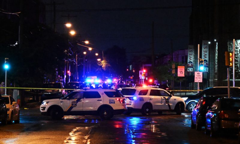 PHILADELPHIA, PENNSYLVANIA - JULY 3: Police work the scene of a shooting on July 3, 2023 in Philadelphia, Pennsylvania. Early reports say the suspect is in custody after shooting 6 people in the Kingsessing section of Philadelphia on July 3rd. (Photo by Drew Hallowell/Getty Images)