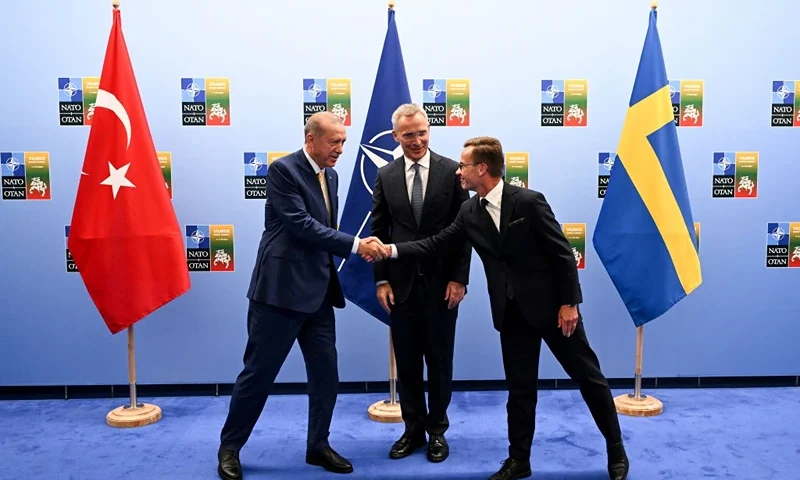 VILNIUS, LITHUANIA - JULY 10: Turkish President Recep Tayyip Erdogan (L) shakes hands with Swedish Prime Minister Ulf Kristersson (R) as the Secretary General of NATO Jens Stoltenberg (C) looks on during their meeting ahead of the NATO Summit on July 11, 2023 in Vilnius, Lithuania. The summit is bringing together NATO members and partner countries heads of state from July 11-12 to chart the alliance's future, with Sweden's application for membership and Russia's ongoing war in Ukraine as major topics on the summit agenda. (Photo by Filip Singer - Pool/Getty Images)