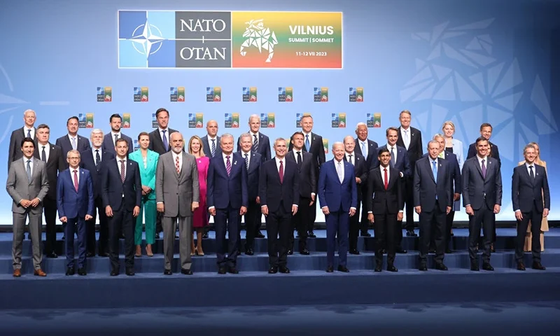 VILNIUS, LITHUANIA - JULY 11: (Back Row L-R) Latvian Prime Minister Krisjanis Karins, Luxembourg Prime Minister Xavier Bettel, Incumbent president of Montenegro Jakov Milatovic, Dutch Prime Minister Mark Rutte, Prime Minister of North Macedonia Dimitar Kovačevski, Prime Minister of Norway Jonas Gahr Støre, President of Poland Andrzej Duda, Prime Minister of Portugal Antonio Costa, Romanian President Klaus Iohannes, President of Slovakia Zuzana Čaputová, Sweden's Prime Minister Ulf Kristersson (Middle Row L-R) President of the Czech Republic Petr Pavel, President of the Czech Republic Petr Pavel, Danish Prime Minister Mette Frederiksen, Prime Minister of Estonia Kaja Kallas, President of Finland Sauli Niinistö, President of France Emmanuel Macron, German Chancellor Olaf Scholz, Prime Minister of Greece Kyriakos Mitsotakis, Hungarian Prime Minister Viktor Orbán, Iceland Prime Minister Katrín Jakobsdóttir (obscured) Italian Prime Minister Giorgia Meloni (obscured), (Front Row L-R) Canadian Prime Minister Justin Trudeau, Prime Minister of Bulgaria Nikolai Denkov, Prime Minister of Belgium Alexander De Croo, Albanian Prime Minister Edi Rama, President of Lithuania, Gitanas Nauseda, NATO Secretary General Jens Stoltenberg, US President Joe Biden, UK Prime Minister Rishi Sunak, Turkish President Recep Tayyip Erdoğan, Prime Minister of Spain Pedro Sánchez and Slovenian Prime Minister Robert Golob pose for a family photograph on the first day of the 2023 NATO Summit on July 11, 2023 in Vilnius, Lithuania. The summit is bringing together NATO members and partner countries heads of state from July 11-12 to chart the alliance's future, with Sweden's application for membership and Russia's ongoing war in Ukraine as major topics on the summit agenda. (Photo by Paulius Peleckis/Getty Images)