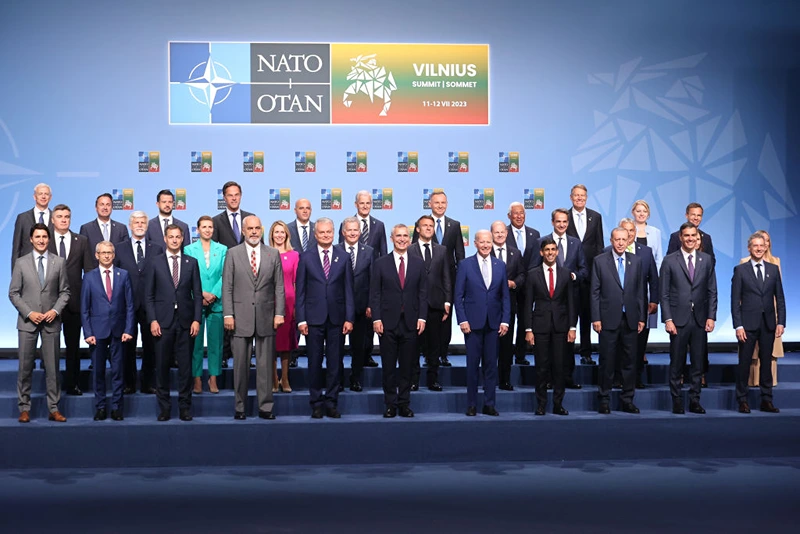 VILNIUS, LITHUANIA - JULY 11: (Back Row L-R) Latvian Prime Minister Krisjanis Karins, Luxembourg Prime Minister Xavier Bettel, Incumbent president of Montenegro Jakov Milatovic, Dutch Prime Minister Mark Rutte, Prime Minister of North Macedonia Dimitar Kovačevski, Prime Minister of Norway Jonas Gahr Støre, President of Poland Andrzej Duda, Prime Minister of Portugal Antonio Costa, Romanian President Klaus Iohannes, President of Slovakia Zuzana Čaputová, Sweden's Prime Minister Ulf Kristersson (Middle Row L-R) President of the Czech Republic Petr Pavel, President of the Czech Republic Petr Pavel, Danish Prime Minister Mette Frederiksen, Prime Minister of Estonia Kaja Kallas, President of Finland Sauli Niinistö, President of France Emmanuel Macron, German Chancellor Olaf Scholz, Prime Minister of Greece Kyriakos Mitsotakis, Hungarian Prime Minister Viktor Orbán, Iceland Prime Minister Katrín Jakobsdóttir (obscured) Italian Prime Minister Giorgia Meloni (obscured), (Front Row L-R) Canadian Prime Minister Justin Trudeau, Prime Minister of Bulgaria Nikolai Denkov, Prime Minister of Belgium Alexander De Croo, Albanian Prime Minister Edi Rama, President of Lithuania, Gitanas Nauseda, NATO Secretary General Jens Stoltenberg, US President Joe Biden, UK Prime Minister Rishi Sunak, Turkish President Recep Tayyip Erdoğan, Prime Minister of Spain Pedro Sánchez and Slovenian Prime Minister Robert Golob pose for a family photograph on the first day of the 2023 NATO Summit on July 11, 2023 in Vilnius, Lithuania. The summit is bringing together NATO members and partner countries heads of state from July 11-12 to chart the alliance's future, with Sweden's application for membership and Russia's ongoing war in Ukraine as major topics on the summit agenda. (Photo by Paulius Peleckis/Getty Images)