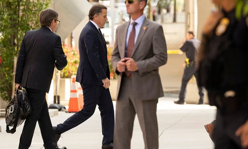 Hunter Biden (2nd L), son of US President Joe Biden, arrives at the J. Caleb Boggs Federal Building in Wilmington, Delaware, on July 26, 2023, to attend a change of plea hearing. Hunter Biden faces two misdemeanor charges for failure to pay taxes. The hearing is also expected to address an agreement between federal prosecutors and Biden to avoid prosecution for a felony charge of illegally possessing a firearm. (Photo by RYAN COLLERD / AFP) / ALTERNATIVE CROP (Photo by RYAN COLLERD/AFP via Getty Images)