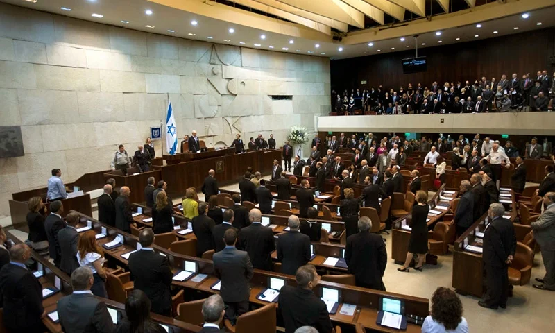 JERUSALEM, ISRAEL - FEBRUARY 05: Members of the 19th Knesset, the new Israeli parliament, stand as President Shimon Peres arrives to the swearing-in ceremony of the 19th Knesset, the new Israeli parliament on February 5, 2013 in Jerusalem, Israel. President Peres welcomed 120 new and returning MKs. (Photo by Ronen Zvulun-Pool/Getty Images)