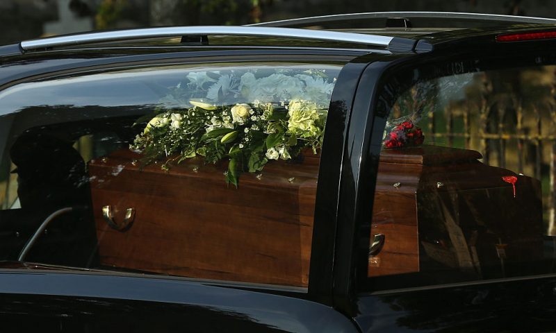 A close-up view of a coffin as a funeral cortege carrying the victims of last Friday's terrorist attack in Tunisia drives through the village of Brize Norton after arriving at the nearby RAF airbase on July 1, 2015 in Brize Norton, England. British nationals Adrian Evans, Charles Evans, Joel Richards, Carly Lovett, Stephen Mellor, John Stollery and Denis and Elaine Thwaites are the first of the victims of last week's terror attack to be repatriated. (Photo by Dan Kitwood/Getty Images)