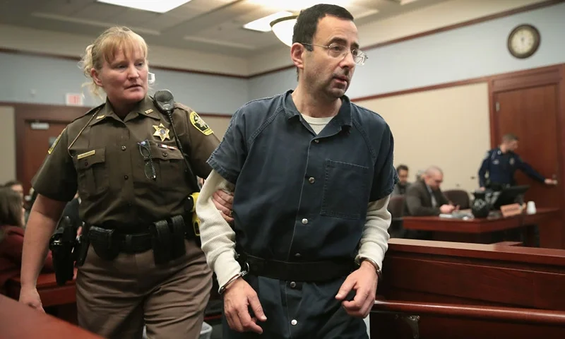 LANSING, MI - JANUARY 17: Larry Nassar appears in court to listen to victim impact statements during his sentencing hearing after being accused of molesting more than 100 girls while he was a physician for USA Gymnastics and Michigan State University where he had his sports-medicine practice on January 17, 2018 in Lansing, Michigan. Nassar has pleaded guilty in Ingham County, Michigan, to sexually assaulting seven girls, but the judge is allowing all his accusers to speak. Nassar is currently serving a 60-year sentence in federal prison for possession of child pornography. (Photo by Scott Olson/Getty Images)