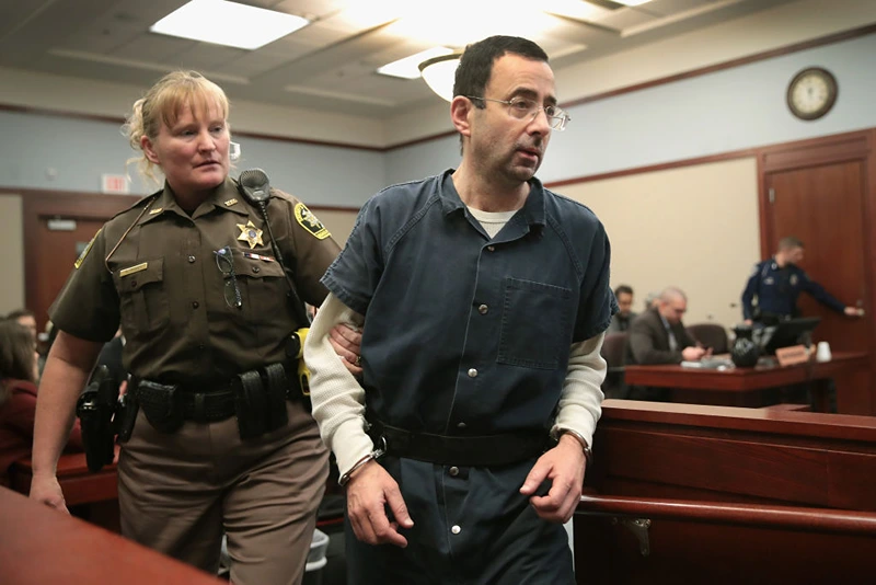 LANSING, MI - JANUARY 17: Larry Nassar appears in court to listen to victim impact statements during his sentencing hearing after being accused of molesting more than 100 girls while he was a physician for USA Gymnastics and Michigan State University where he had his sports-medicine practice on January 17, 2018 in Lansing, Michigan. Nassar has pleaded guilty in Ingham County, Michigan, to sexually assaulting seven girls, but the judge is allowing all his accusers to speak. Nassar is currently serving a 60-year sentence in federal prison for possession of child pornography. (Photo by Scott Olson/Getty Images)