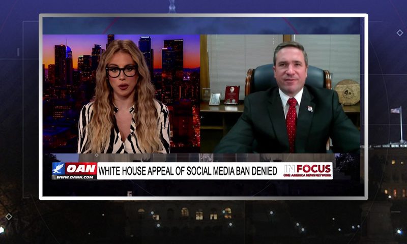 Video still from Andrew Bailey's interview with In Focus on One America News Network