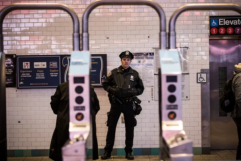 NEW YORK, NY - DECEMBER 11: A New York City Police Department officer stands watch at the entrance to the Times Square subway station during the evening rush hour, December 11, 2017 in New York City. The Police Department said that one person, Akayed Ullah, is in custody for an attempted terror attack after an explosion in a passageway linking the Port Authority Bus Terminal with the subway. (Photo by Drew Angerer/Getty Images)