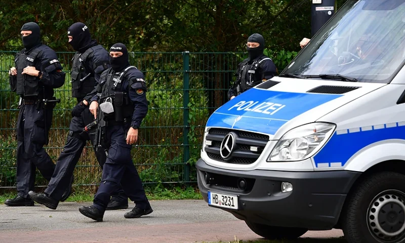 BREMEN, GERMANY - JULY 23: Heavily armed police forces, equipped with Heckler & Koch MP5 machine gun, secure the funeral of Hells Angels motorcycle member Rainer Kopperschmidt at Walle cemetery on July 23, 2020 in Bremen, Germany. Kopperschmidt founded the first German branch of the Hells Angels in Hamburg in 1973. The Hells Angels have a strong following in Germany and have a role in the country's organized crime, including the drug trade, prostitution and illegal weapons trade. (Photo by Alexander Koerner/Getty Images)