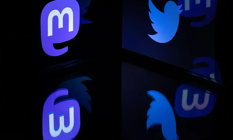 This photograph taken on November 7, 2022 shows the logos of social networks Twitter and Mastodon reflected in smartphone screens, in Paris. (Photo by JOEL SAGET / AFP) (Photo by JOEL SAGET/AFP via Getty Images)