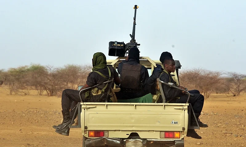 TOPSHOT - Niger's army forces patrol near the new UNHCR Imbaidou refugee camp, on May 29, 2012, near Ayorou, north-west of Niamey in Niger, where Malian refugees have found shelter. - African Union chief Thomas Boni Yayi called on May 30 for the creation of a UN-backed force to intervene in Mali, where Islamist militants and Tuareg rebels have declared independence in the north. AFP PHOTO / ISSOUF SANOGO (Photo by Issouf SANOGO / AFP) (Photo by ISSOUF SANOGO/AFP via Getty Images)