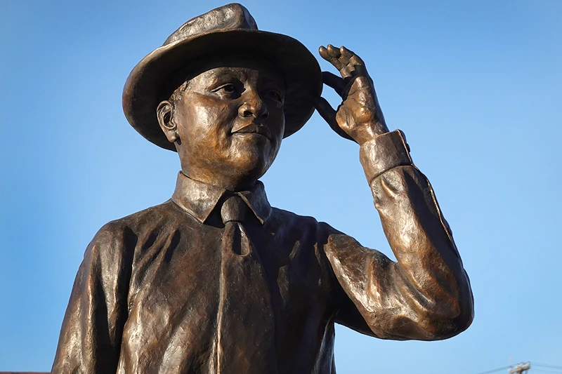 GREENWOOD, MISSISSIPPI - OCTOBER 21: A statue of Emmett Till is unveiled on October 21, 2022 in Greenwood, Mississippi. 14-year old Emmett Till, a Black teenager in town from Chicago visiting family in August 1955, was accused of flirting with Carolyn Bryant, a white woman working at the shop. Till was later kidnapped from his uncle's home and murdered during a brutal, racist attack. His death is attributed to being the spark that ignited the civil rights movement. Today the nearby town of Greenwood will dedicate a statue of Till in the city's downtown. (Photo by Scott Olson/Getty Images)
