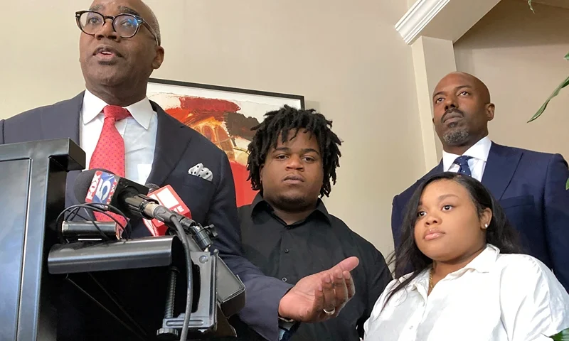 Attorney Roderick Edmond, from left, joined by Treveon Isaiah Taylor, Sr., Jessica Ross and attorney Cory Lynch, speaks during a news conference, Wednesday, Aug. 9, 2023, in Atlanta, announcing a lawsuit against a doctor and Southern Regional Medical Center, a hospital south of Atlanta where Ross went on July 9 to have her son. A doctor used too much force and decapitated Ross's baby during delivery according to the lawsuit filed Wednesday, the attorneys said. (AP Photo/Sudhin Thanawala)
