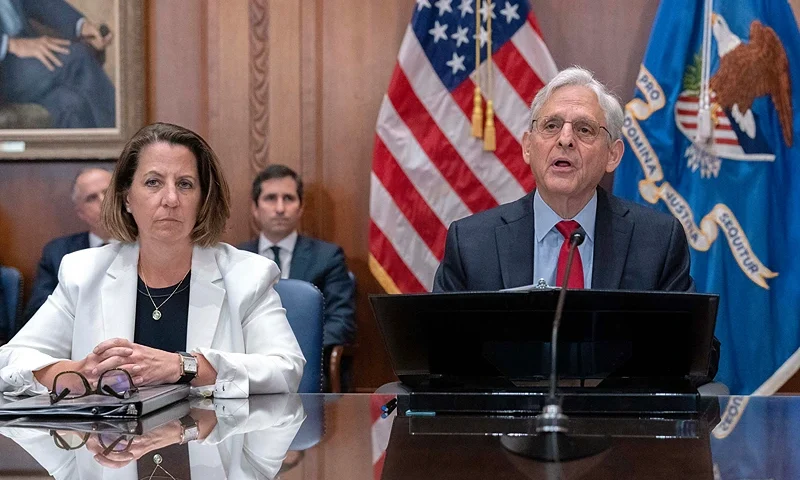 Pandemic Aid Great Grift Justice Department FILE - Attorney General Merrick Garland accompanied by Deputy Attorney General Lisa Monaco speaks during a meeting at Department of Justice in Washington, June 14, 2023. Hundreds of people have been charged with the theft of more than $830 million in COVID-19 emergency aid following a nationwide operation conducted by federal, state and local law enforcement agencies, the U.S. Justice Department announced Wednesday. (AP Photo/Jose Luis Magana, File)