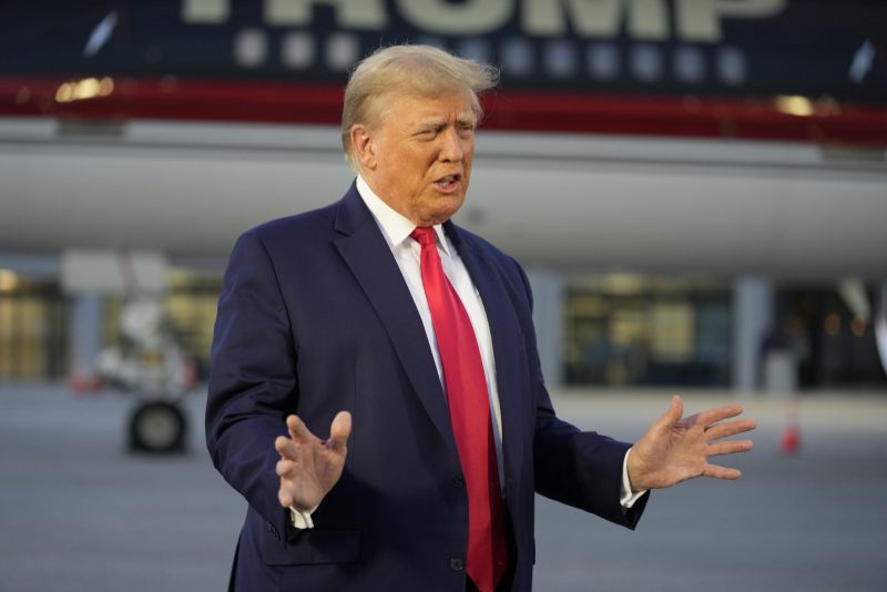 Former President Donald Trump speaks with reporters before departure from Hartsfield-Jackson Atlanta International Airport, Thursday, Aug. 24, 2023, in Atlanta. (AP Photo/Alex Brandon)