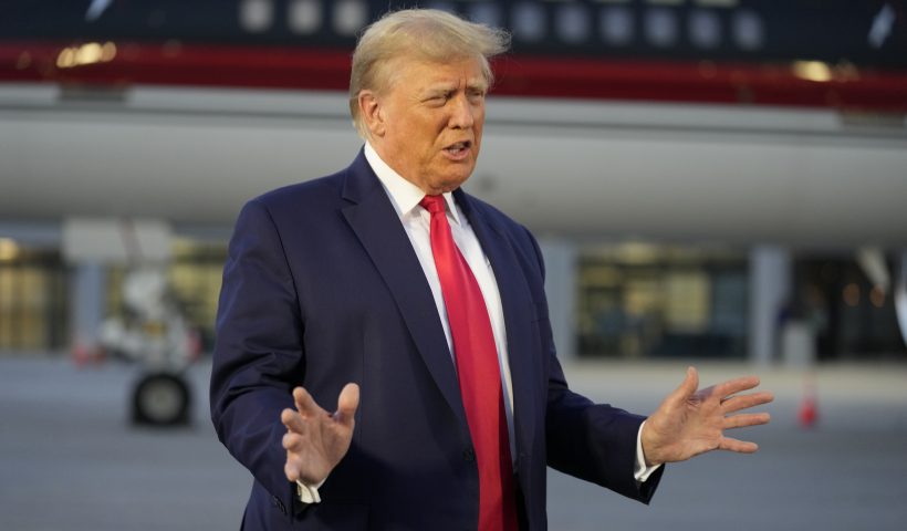 Former President Donald Trump speaks with reporters before departure from Hartsfield-Jackson Atlanta International Airport, Thursday, Aug. 24, 2023, in Atlanta. (AP Photo/Alex Brandon)