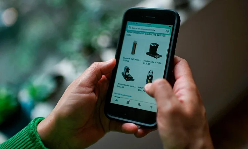 A woman uses an e-commerce platform, in Mexico City, on September 29, 2020, amid the COVID-19 coronavirus pandemic. - Forced by a semester-long lockdown, millions of Latin Americans forgot their doubts and fears to buy necessary or leisure goods online, making e-commerce the big winner in this COVID-19 pandemic. (Photo by PEDRO PARDO / AFP) (Photo by PEDRO PARDO/AFP via Getty Images)