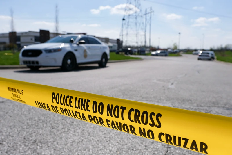US-crime-shooting Police caution tape blocks the entrance to the site of a mass shooting at a FedEx facility in Indianapolis, Indiana on Friday, April 16, 2021. - A gunman has killed at least eight people at the facility before turning the gun on himself in the latest in a string of mass shootings in the country, authorities said. The incident came a week after President Joe Biden branded US gun violence an "epidemic" and an "international embarrassment" as he waded into the tense debate over gun control, a powerful political issue in the US. (Photo by Jeff Dean / AFP) (Photo by JEFF DEAN/AFP via Getty Images)