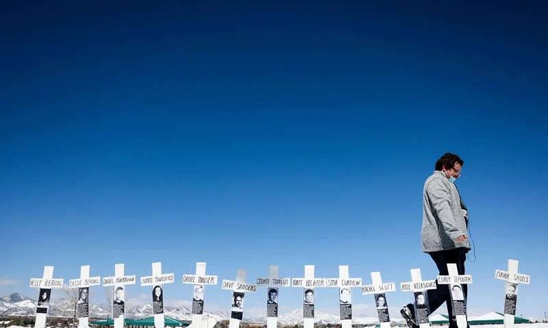 LITTLETON, CO - APRIL 20: Tyler Vielie walks past crosses with the names of the victims of the Columbine High School shooting next to the Columbine Memorial on April 20, 2021 in Littleton, Colorado. Twelve students and a teacher were killed in the mass shooting 22 years ago today, which at the time was the deadliest school shooting in US history. (Photo by Michael Ciaglo/Getty Images)