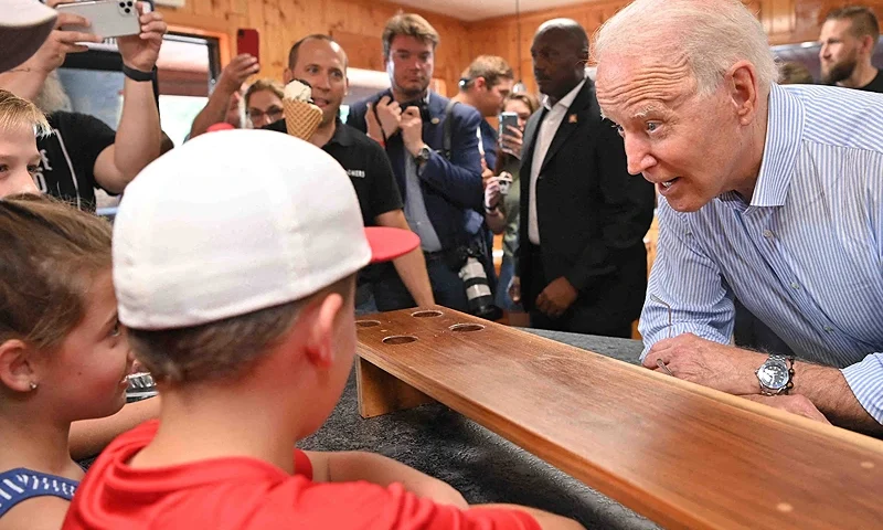 US President Joe Biden speaks with people before getting ice cream at Moomers Homemade Ice Cream in Traverse City, Michigan on July 3, 2021. (Photo by MANDEL NGAN / AFP) (Photo by MANDEL NGAN/AFP via Getty Images)