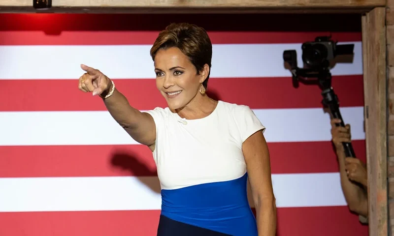 CHANDLER, AZ - SEPTEMBER 20: Arizona Republican nominee for governor Kari Lake greets the audience during a stop on her Ask Me Anything Tour at American Way Market on September 20, 2022 in Chandler, Arizona. Lake, the Trump-endorsed nominee for governor, faces Democrat Secretary of State Katie Hobbs in November. (Photo by Rebecca Noble/Getty Images)