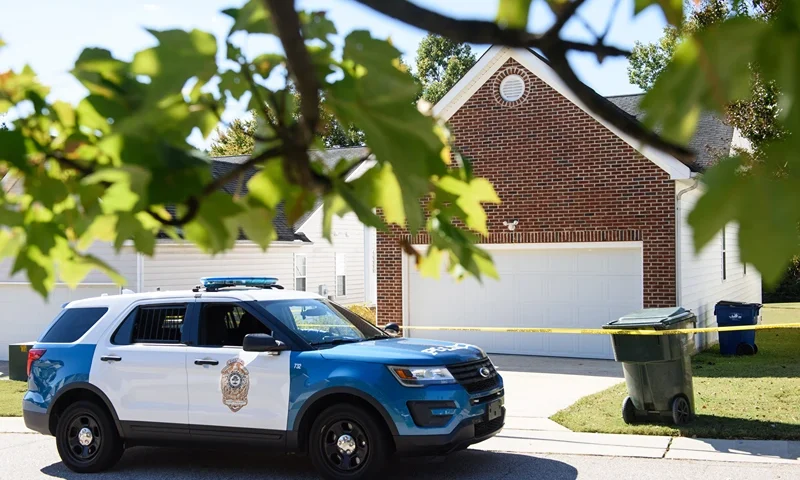 Shooting Leaves 5 Dead In Suburban Neighborhood Of Raleigh, North Carolina RALEIGH, NC - OCTOBER 14: A police officer parks in front of the home of the suspect of a shooting in Raleigh that left 5 dead and 2 injured on October 14, 2022 in Raleigh, North Carolina. The suspect is in custody and being treated at Wake Med Hospital. (Photo by Melissa Sue Gerrits/Getty Images)