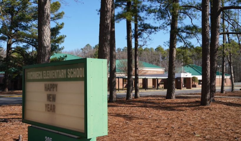 NEWPORT NEWS, VA - JANUARY 07: A school sign wishing students a "Happy New Year" is seen outside Richneck Elementary School on January 7, 2023 in Newport News, Virginia. A 6-year-old student was taken into custody after reportedly shooting a teacher during an altercation in a classroom at Richneck Elementary School on Friday. The teacher, a woman in her 30s, suffered “life-threatening” injuries and remains in critical condition, according to police reports. (Photo by Jay Paul/Getty Images)
