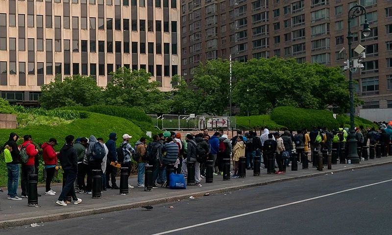 NEW YORK, NEW YORK - JUNE 6: Hundreds of asylum seekers line up outside of the Jacob K. Javits Federal Building on June 6, 2023 in New York City. New York City has provided sanctuary to over 46,000 asylum seekers since 2013, when the city passed a law prohibiting city agencies from cooperating with federal immigration enforcement agencies unless there is a warrant for the person's arrest.(Photo by David Dee Delgado/Getty Images)