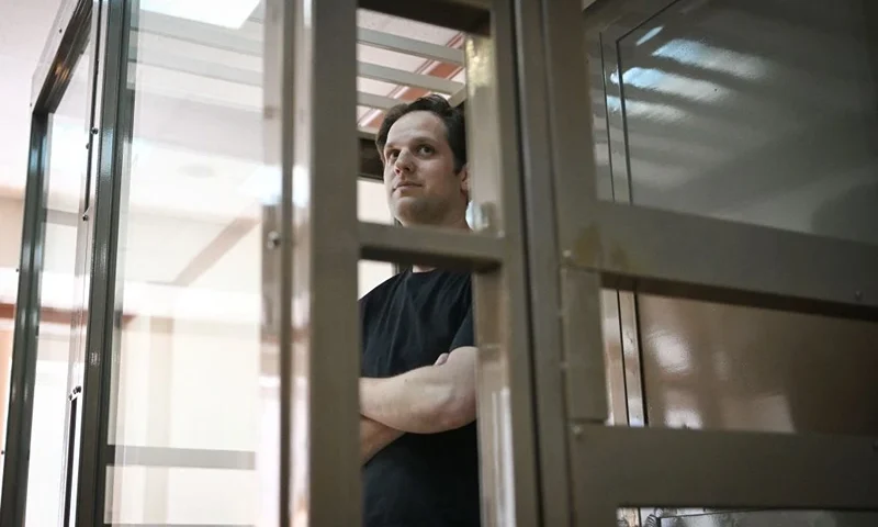 US journalist Evan Gershkovich, arrested on espionage charges, stands inside a defendants' cage before a hearing to consider an appeal on his extended detention at The Moscow City Court in Moscow on June 22, 2023. (Photo by Natalia KOLESNIKOVA / AFP) (Photo by NATALIA KOLESNIKOVA/AFP via Getty Images)