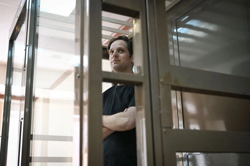 US journalist Evan Gershkovich, arrested on espionage charges, stands inside a defendants' cage before a hearing to consider an appeal on his extended detention at The Moscow City Court in Moscow on June 22, 2023. (Photo by Natalia KOLESNIKOVA / AFP) (Photo by NATALIA KOLESNIKOVA/AFP via Getty Images)